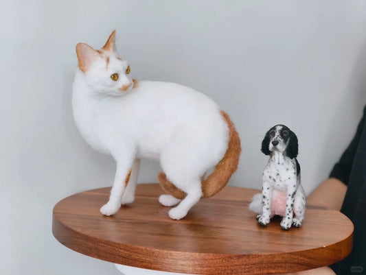 Cat standing on a wooden platform with a dog figurine beside it