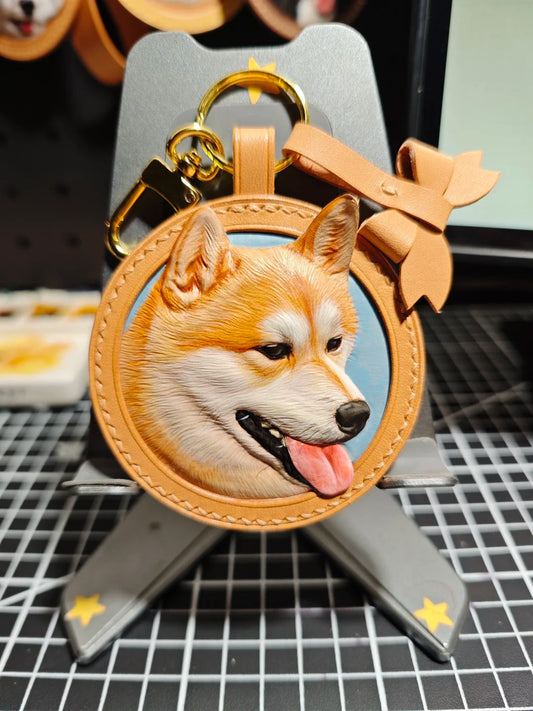 Dog-shaped keychain with a leather border on a stand