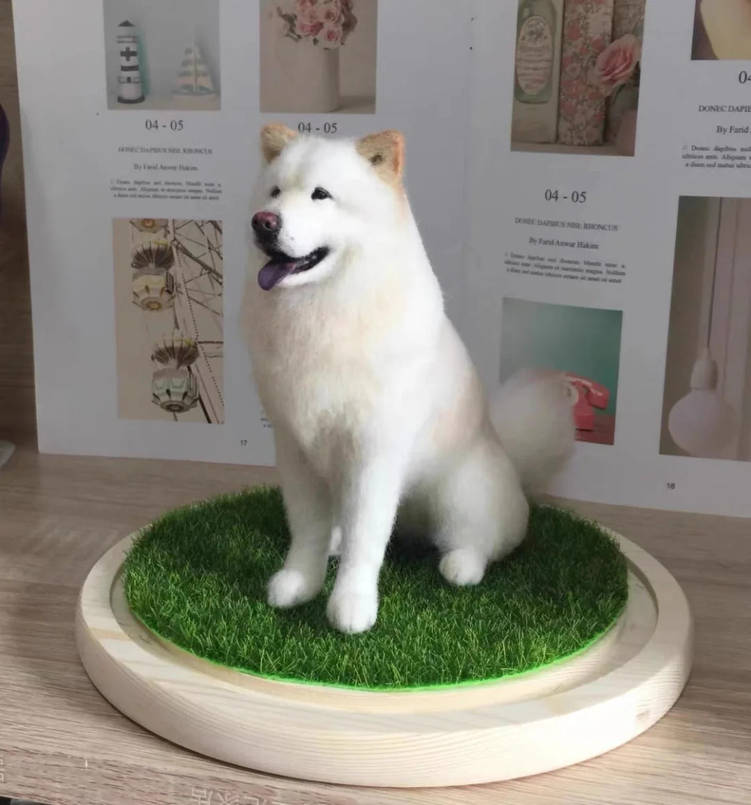 White dog figurine on a grassy platform with a wooden base, against a background of printed pages.